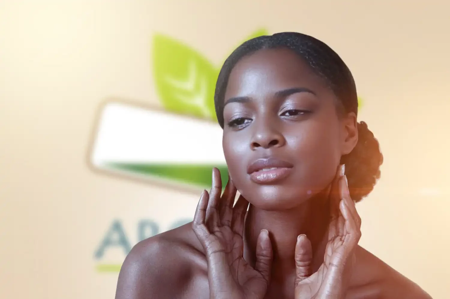 Black woman with clear skin gently applying vegetable oil to her face, radiating a healthy glow